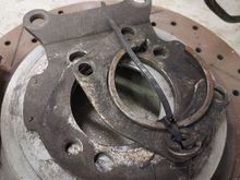 This is the parts i used on my large bearing ford 9". 
The bracket is the factory 89 9 bolt bracket, have a ford bearing retainer and a ittle custom shim  to put psi on outer bearing race. 