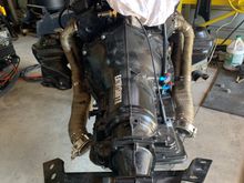 This was an idea I came up a few years back.The only thing is I wish I would’ve made it taller, but it works really well “especially with headers installed.
Bolts to the floor Jack and you use the 2 post lift in conjunction. I can hard mount the engine and tranny in 5 minutes by myself. The photos aren’t in order, feel free to use the idea. 