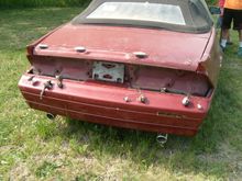 good rear bumper,trunk,etc....center spoiler is inside car....it needs repair to the fasteners....if i needed one,i'd fix it.....but that be up to you....