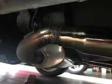 Mine have been tucked and the angle modified so that they a pointing more downward. Unmodified, the tips exit at a slight upward angle and the whole tip “hangs” under the rear of the vehicle. I preferred to have the tips tucked where they weren’t as visible from the sides. 