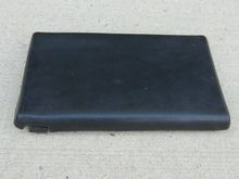 Original console cover on lid (looks ok but) vinyl cover sun damaged and hole drilled through top to hold a cup holder in place. Needs replacing.