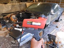 The red bar near the nozzle is the adjustment valve.  Very impressed with performance with modifications.