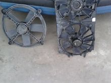 This is the dual fan setup from out of a '00s Chevy Malibu. Next to it is the factory single fan. Note the inefficient shroudless design. This is also the same fan that GM used in 4-cylinder cars, and in my opinion it is just not up to the task of cooling a V6 car, much less a V8.
Fun fact: GM even put that pathetic little fan in V8 cars! My car used to have one!