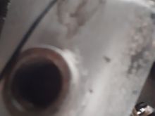 It's hard to see due to lack of light. There is a big "wall" of metal inside the hole. It basically blocks an 02 sensor from being screwed in.

This is on the driver's y-pipe near the header.