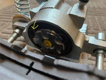 I know that this clip should be on the caliper like this but I don't see how it would attach to the brake pad.