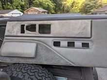 I cleaned the the cloth on this passenger side panel. They cleaned up nice! Thanks to my trusty JEEP you see propping up the panel. 