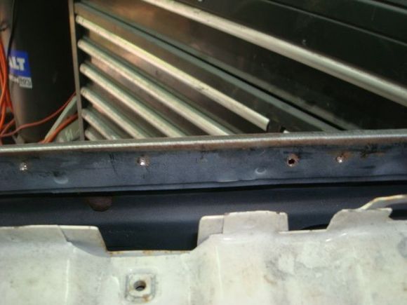 Passenger door, the door frame is original but it was reskinned in 88 or 89. They never bothered to repaint this area.