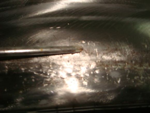 This is how far the wheel flare body line had moved up from the damage. It should be about 3/4 inch from the bottom.