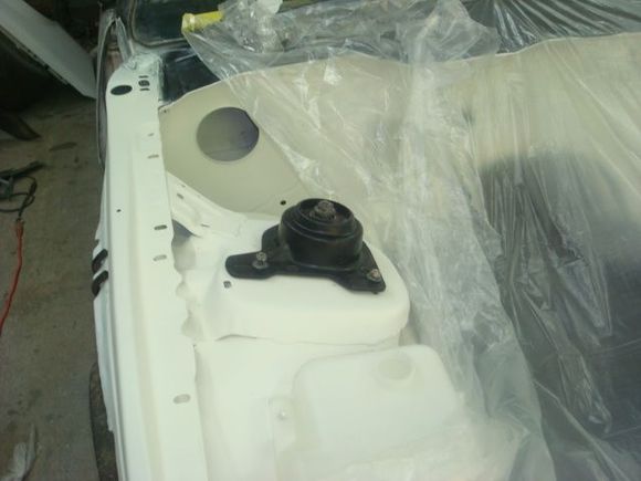 Passenger strut mount loosely installed.