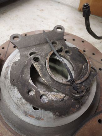 This is the parts i used on my large bearing ford 9". 
The bracket is the factory 89 9 bolt bracket, have a ford bearing retainer and a ittle custom shim  to put psi on outer bearing race. 