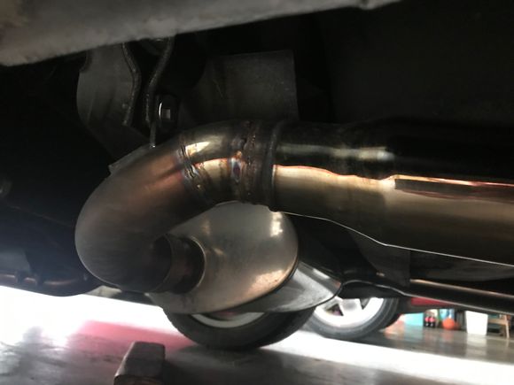 Mine have been tucked and the angle modified so that they a pointing more downward. Unmodified, the tips exit at a slight upward angle and the whole tip “hangs” under the rear of the vehicle. I preferred to have the tips tucked where they weren’t as visible from the sides. 