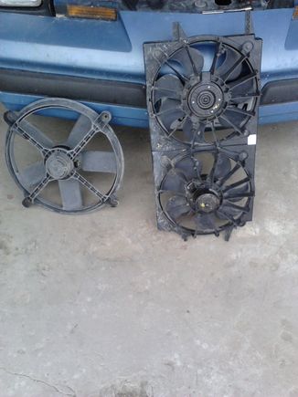 This is the dual fan setup from out of a '00s Chevy Malibu. Next to it is the factory single fan. Note the inefficient shroudless design. This is also the same fan that GM used in 4-cylinder cars, and in my opinion it is just not up to the task of cooling a V6 car, much less a V8.
Fun fact: GM even put that pathetic little fan in V8 cars! My car used to have one!