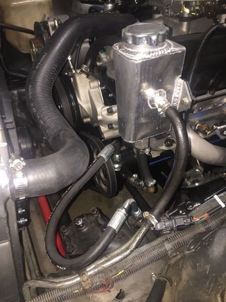 Hard to really see but it’s .125” sheet steel that uses the 3 bolt holes in the passenger side head and holds the reservoir level