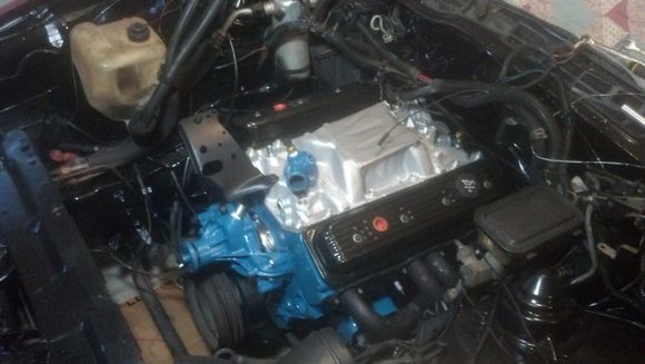 After applying a shoehorn and copious amounts of Vaseline, the new engine is in!