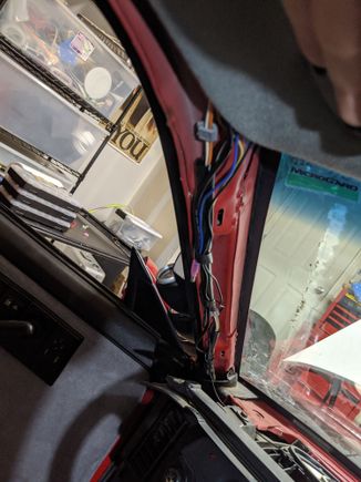 Up the a-pillar and then tuck all the extra wires into the head liner