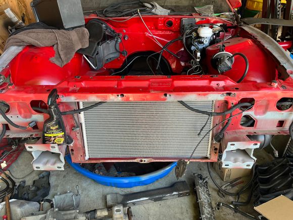 New condenser and old radiator installed. I used the expanding foam strip that you can get from HD to seal in between the two. 