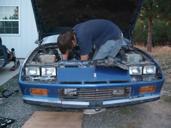 I got tired of leaning over the fenders so after I removed the fan and a few of the pulleys I climbed in to get a better angle. Currently the fenders, hood, motor, and transmission are removed and I will start to reassemble it this coming spring. IROC here I come!