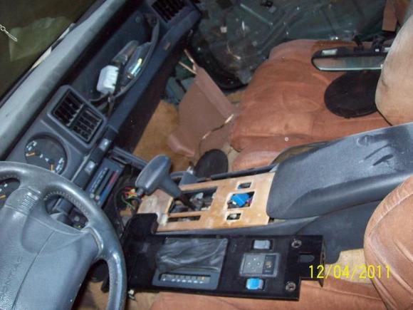 the guy we got it from wanted to make it a luxury T/A. re-upholstered the seats (after stuffing them) withmicrofibers (like for couches, comfy but looks bad) n put cheap home made wood panels on her. dark red paint n bright gold rims was his plan......smh