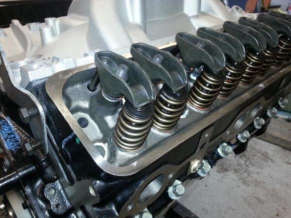 My springs after the heads got back from the machine shop. Had to machine the valve guide boss to fit my springs and installed screw in studs.