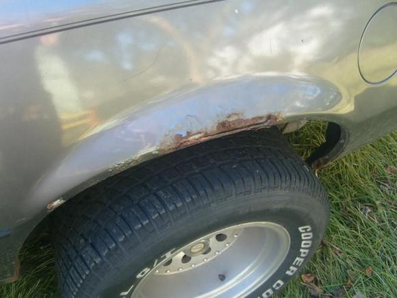 Rust on driverside quarterpanel.