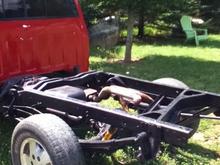 I put Eastwood Rust Converter on the frame, all of it. I even got up under the cab and did all that all the way up to the engine. I then put new rear dampeners on and painted the rust converter over with black Rustolium paint.