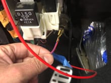 Pulled the red and blue power wire out of the fuel pump relay to hook to the new relay on gm harness