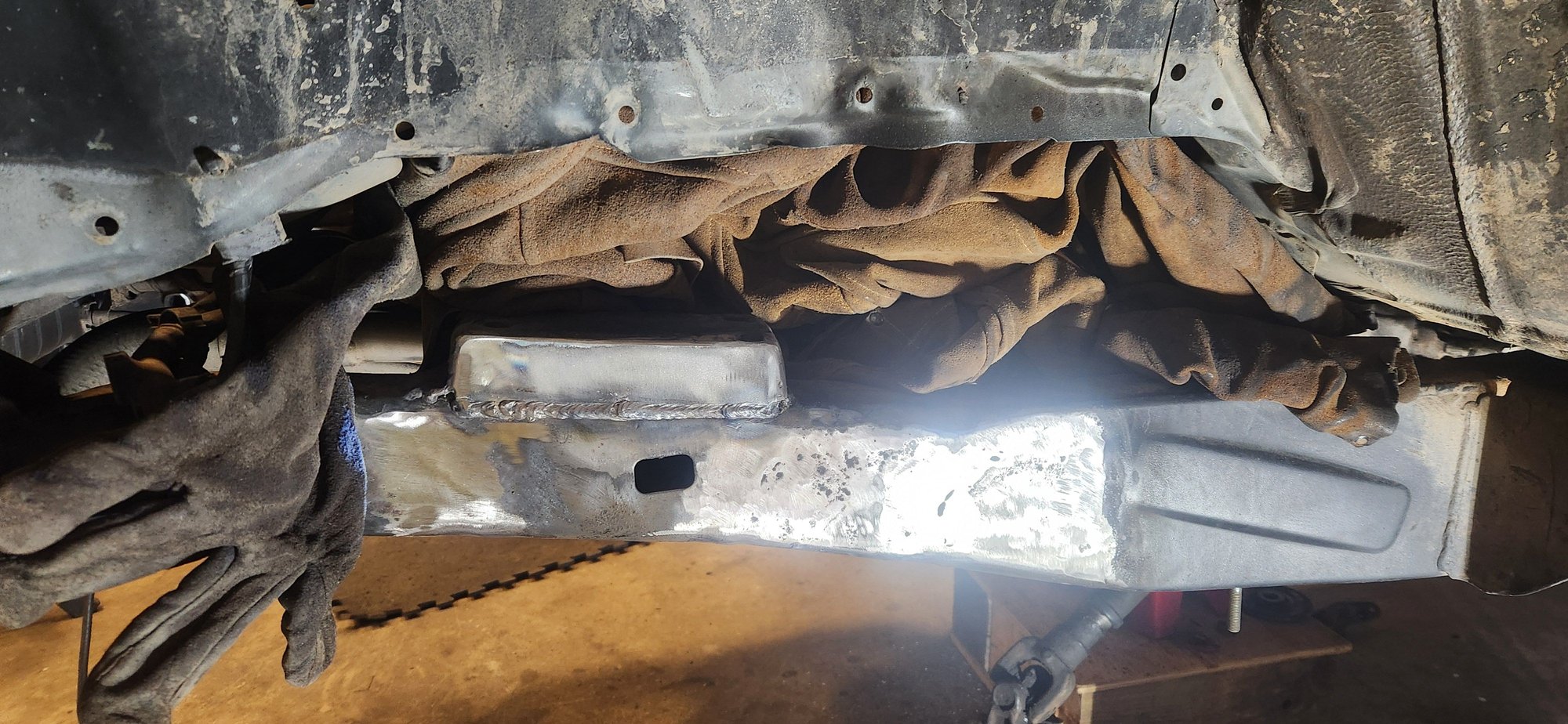 Don't just start welding/torching stuff. Make sure you protect anything that could get burnt. Last thing you want is a fire or burn a wire up.