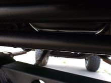 Steering rod self clearancing oil pan