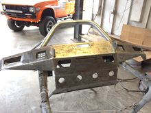 One off bumper made from 1/4 inch steel that bolts to frame in 8 places .
