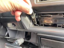 One screw and the switch comes out. The bulb can be accessed from the bottom.
