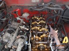 best shot i have of the gauge sender.  the male-terminal blade is visible at the base of injector #2 (just above the coolant bypass hose)