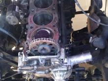 I thought I only needed to replace the head gasket at first, possibly the timing chain.  When I took off the oil pan to get the broken plastic timing guides, I found the trust washers and realized I would need a total rebuild.  Engine in the photo is out of an '83 Toyota Celica with the domed pistons