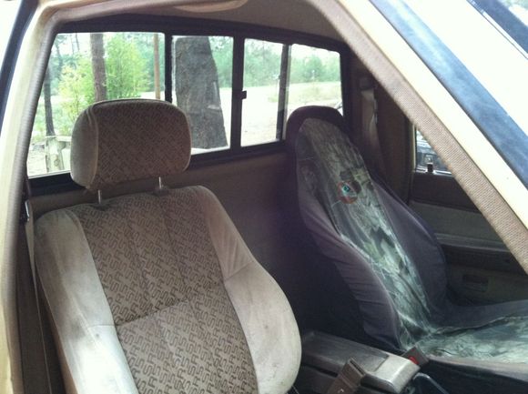 sr5 seats! But the driver's side has zero cushion left.  I'm sitting on the rail.  Maybe junkyard yota seats in the future. Center console hinge is busted and the top is pretty nasty. Read window works about as well as you'd expect for this age.