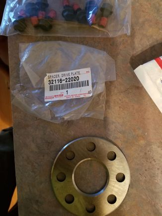 Part # from Toyota for the spacer and flywheel bolts.
 I went on a Toyota parts site and looked both up for a 1993 2jz supra with 4speed automatic