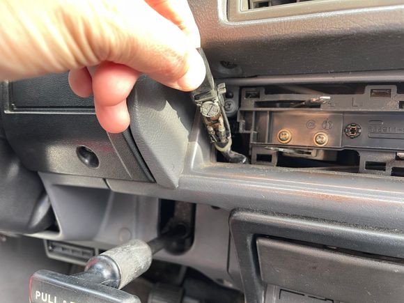 One screw and the switch comes out. The bulb can be accessed from the bottom.