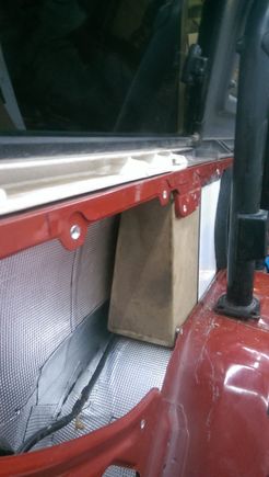 Front side of the box.  I actually unhooked the rear tail light wiring and ran it on the inside of the side panel and metal supports to bypass the box (unlike the factory on the outside of the metal supports)