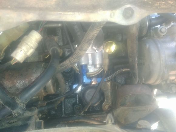 Somewhere in there is the knock sensor, and I'm assuming it's visible but not sure in the thumbnail..