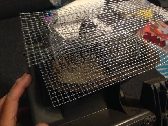 the upper layer can get bent to fit around the cowl box. Its all "wired" together. It should be mouse proof,