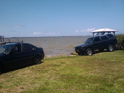 my 4runner and a friends bmw in my back yard after a bath