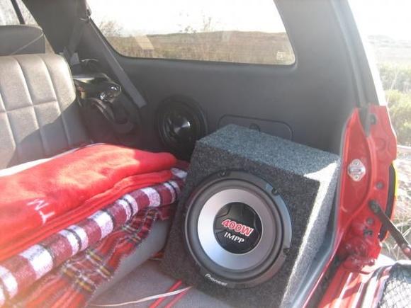 the Optima Yellow-Top is behind that third-row seat.  The 750W mono amplifier for the 10's is underneath the third-row seat.  The 1200W mono amp for the 8's is under the driver's seat.  The 4-channel bridgeable 4x100W amp is under the passenger seat.