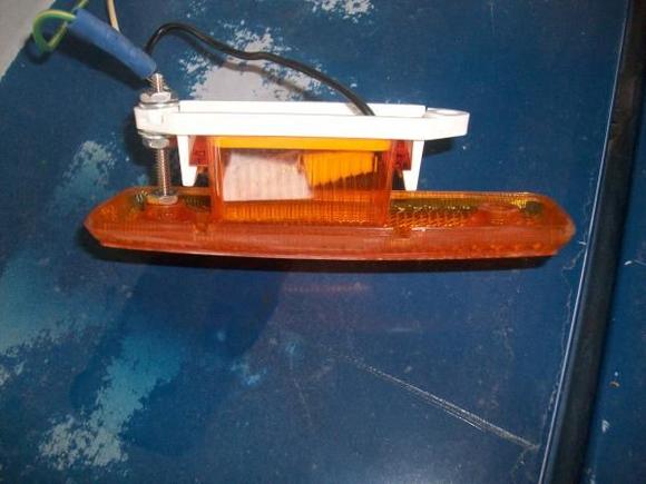 using one long bolt to hold lense to body and the marker light to lense