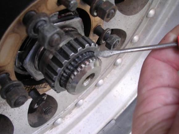 This is how SW gear fits on axle shaft, note the groove where the screwdriver is for the axle snap ring.