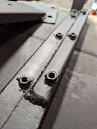 welded nuts because it would be way to difficult to access above the skids