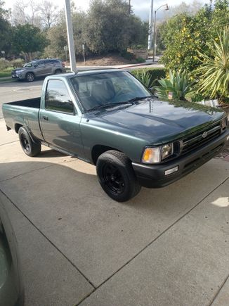 Paint is aftermarket dark forest green with slight metalflake